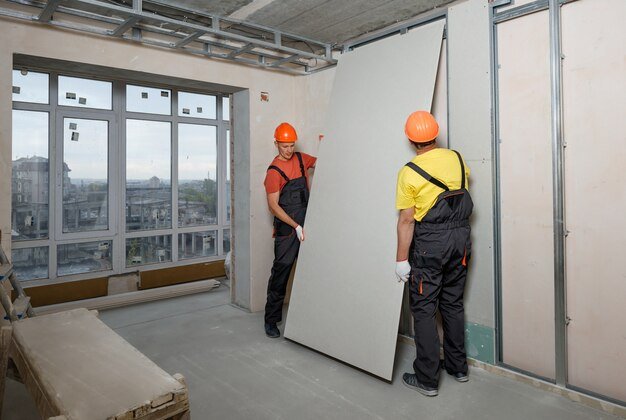 workers are mounting plasterboard wall_191163 1553